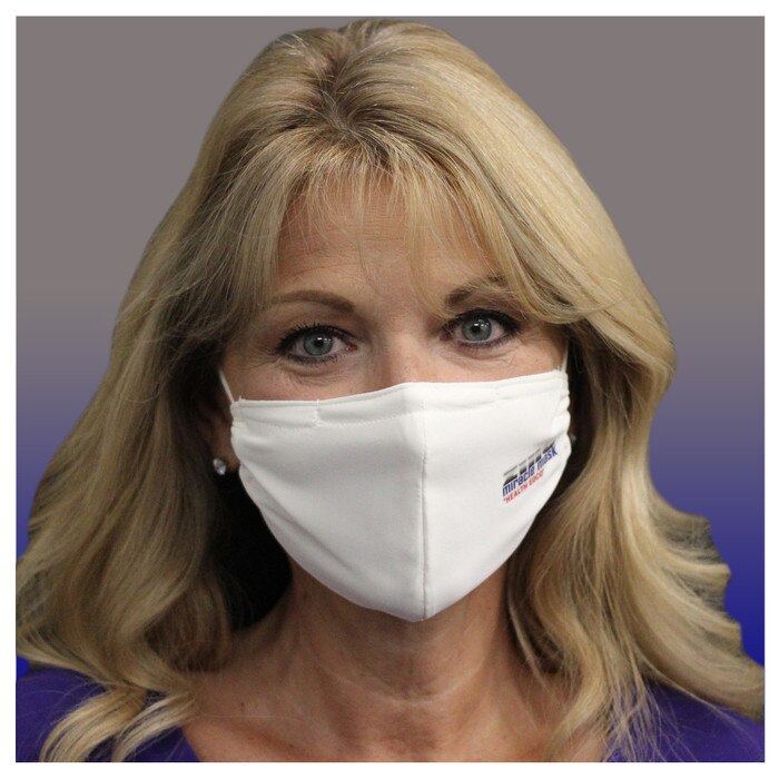 Zinc Miracle Mask by Health Edco, front view of woman wearing one-size-fits-most white cloth fabric face mask, 78866