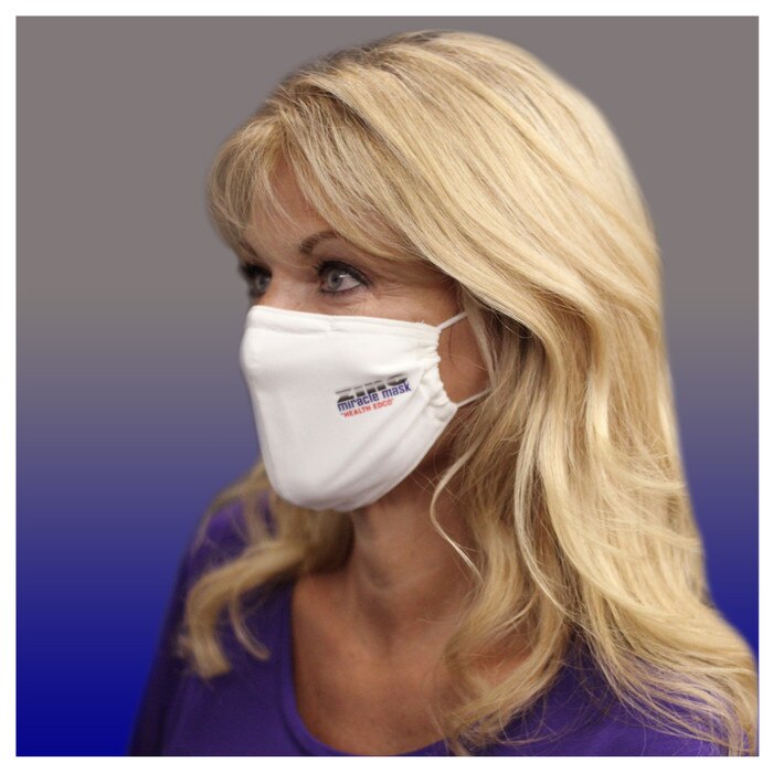 Zinc Miracle Mask by Health Edco, side view of woman wearing one-size-fits-most durable white cloth fabric face mask, 78866