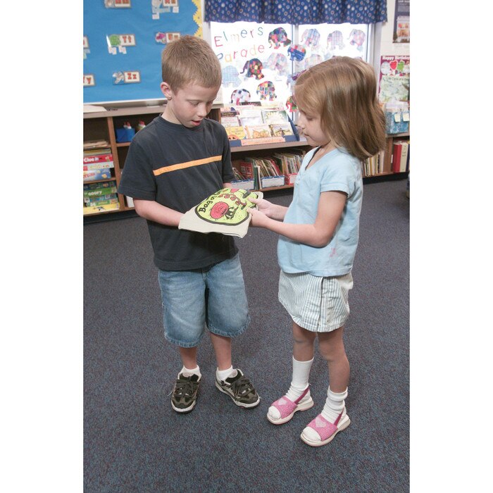 Children passing Bag of Germs with glowing powder to teach importance of proper hand washing technique by Health Edco, 79785