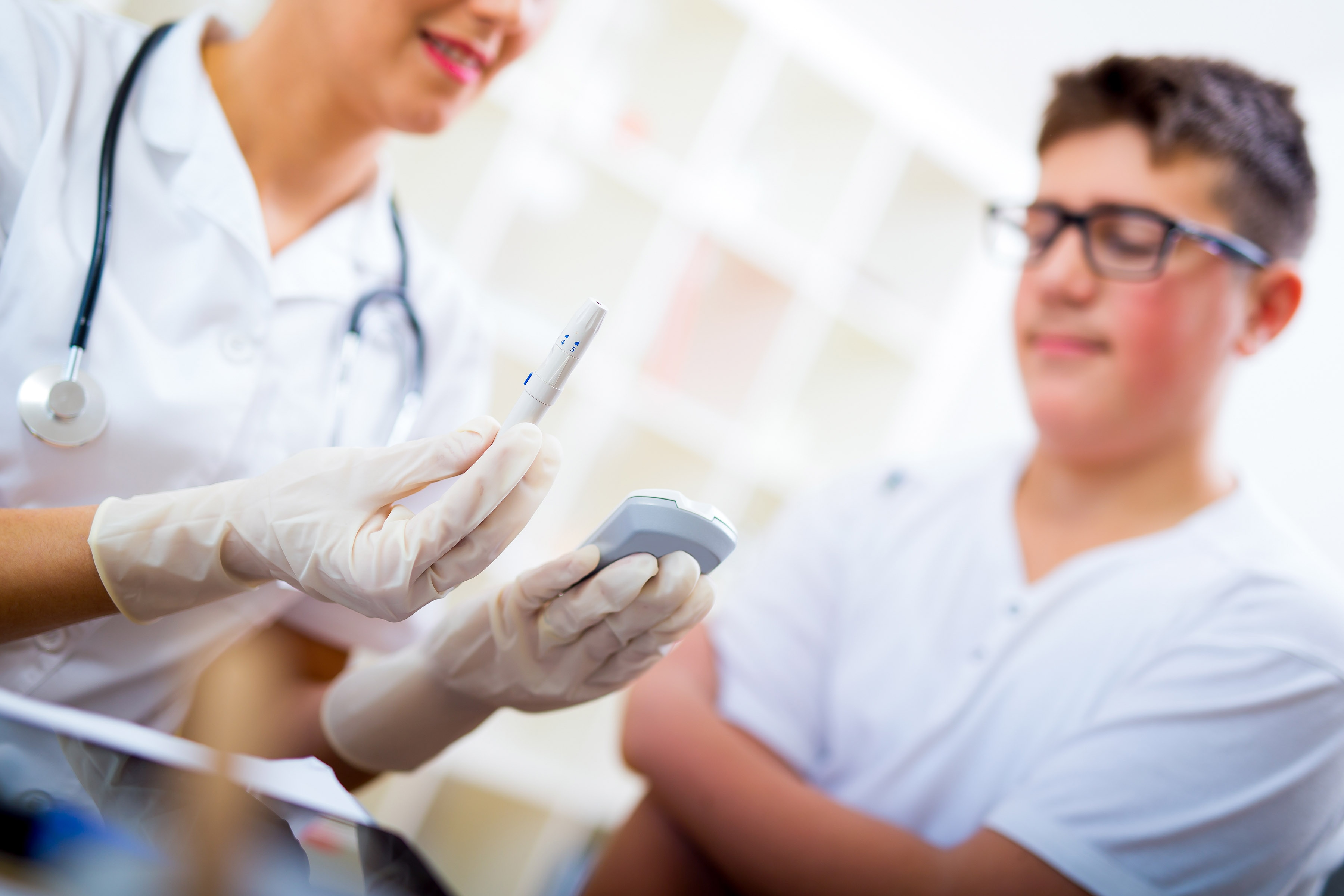 Diabetes educator counseling teenage boy