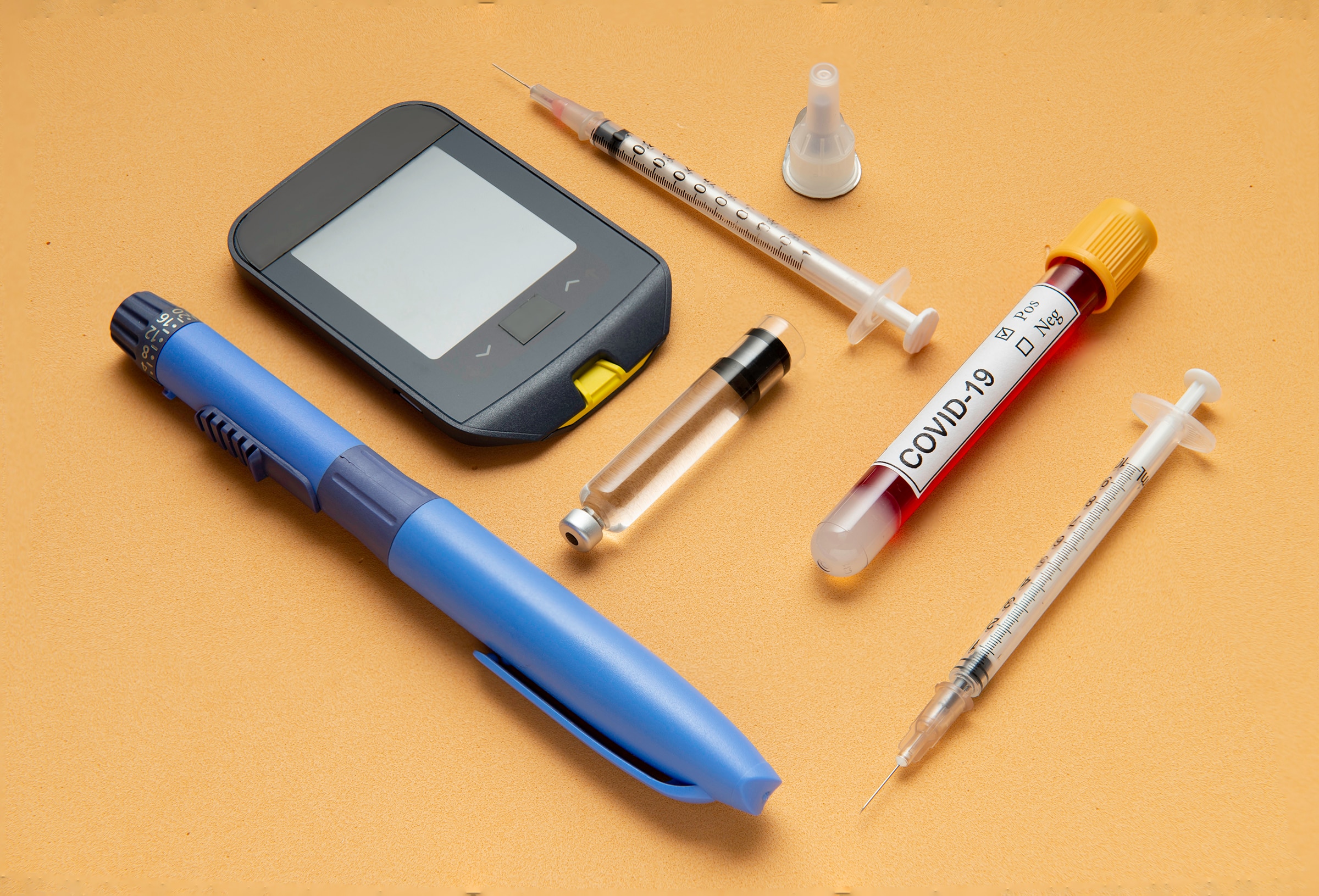 Diabetes materials and a positive test vial for COVID-19