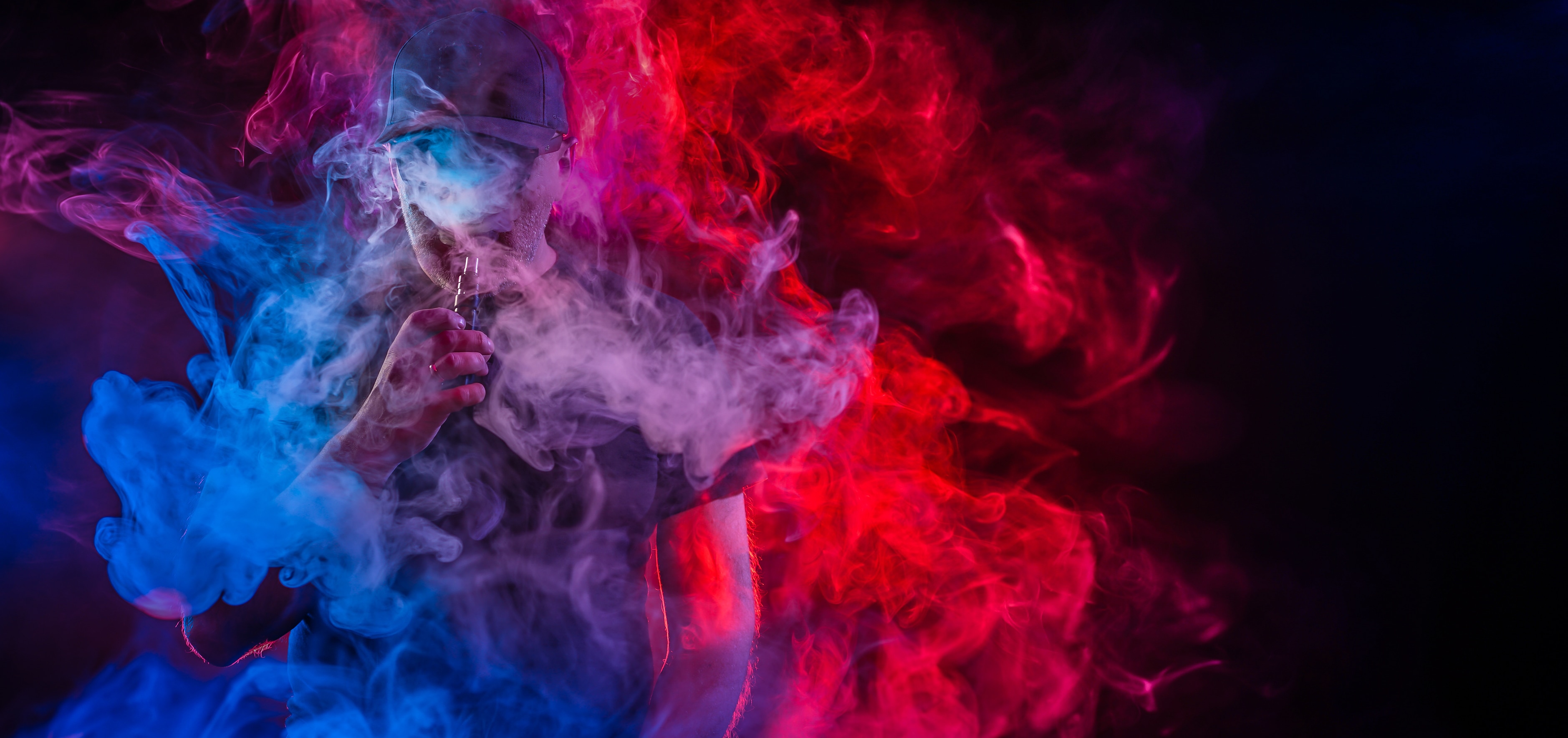 E-Cigarette-User-Surrounded-By-Vapor