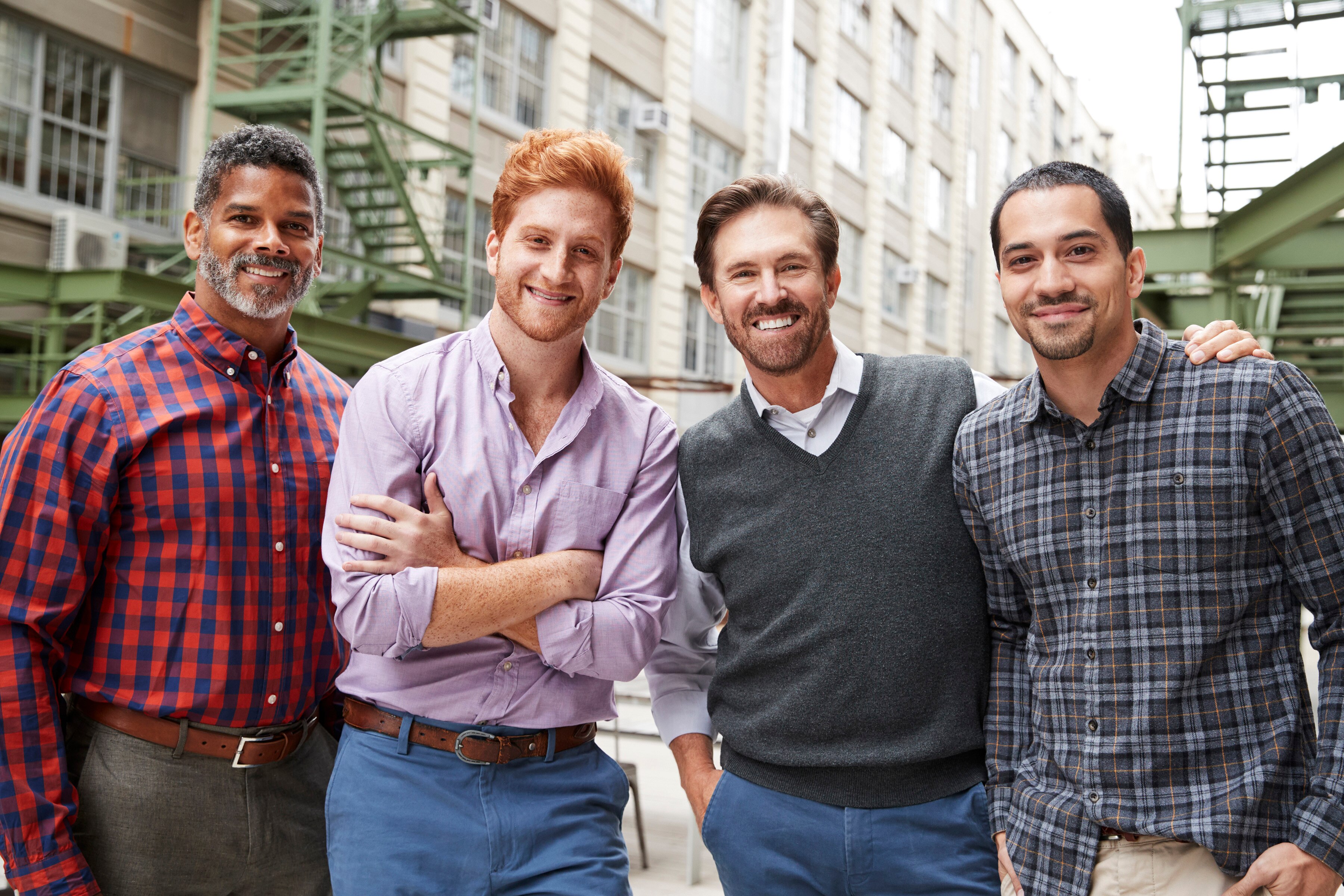 Four smiling men