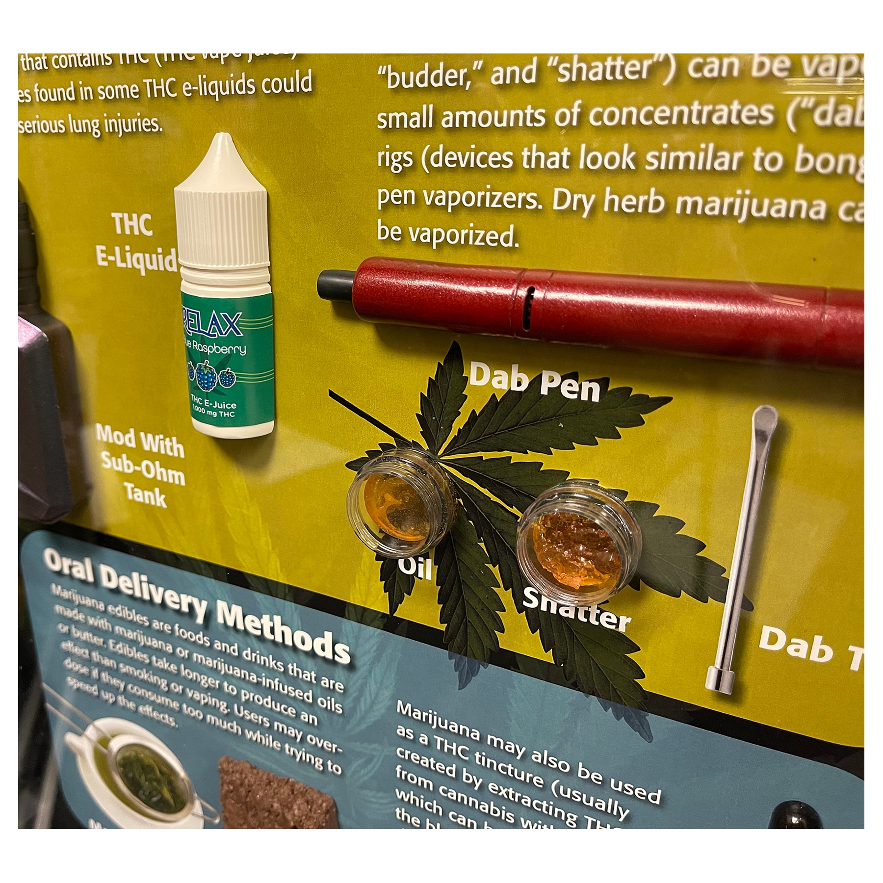 Inset of marijuana concentrate and vaping models in marijuana Health Edco display