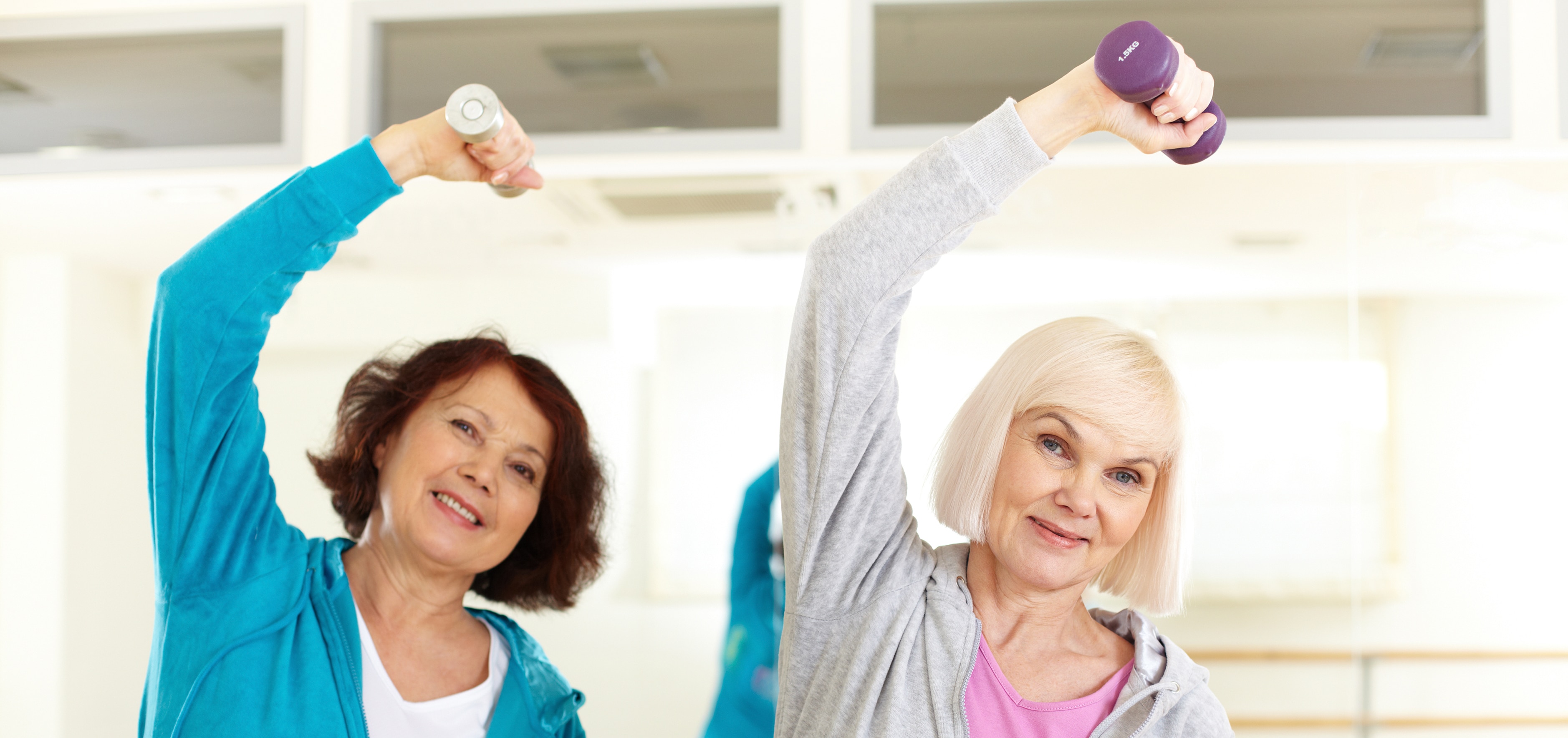 Older women exercising with hand weights