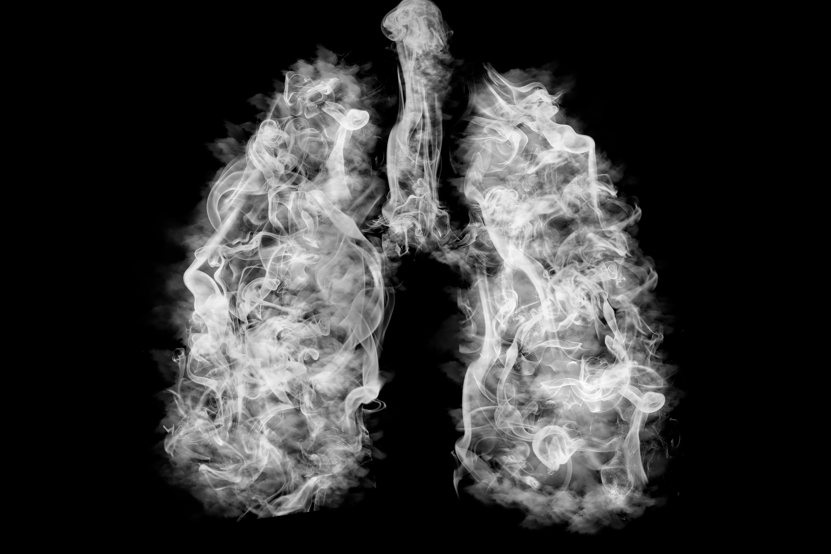 Lungs filled with tobacco smoke signifying how smoking and vaping cause lung damage