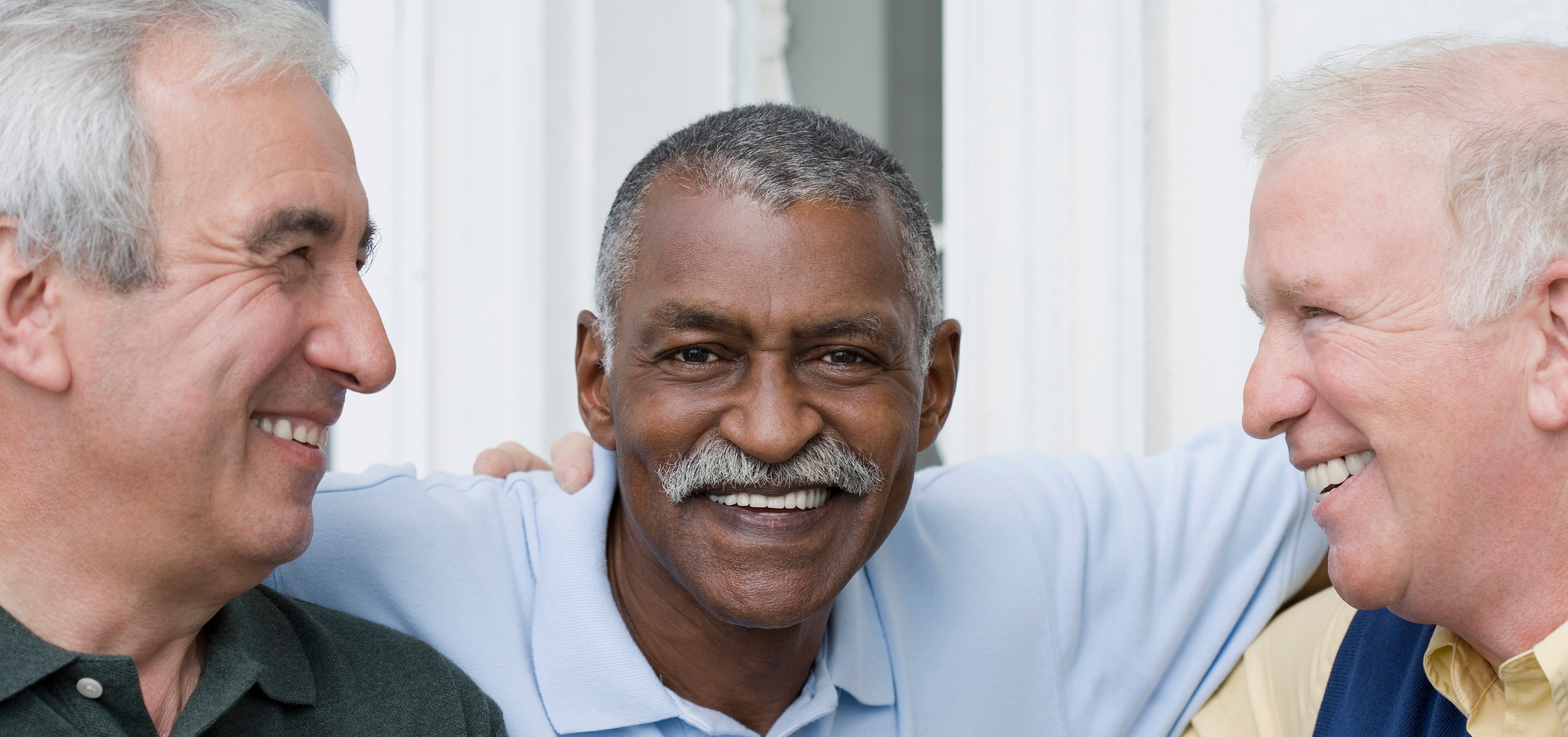 Three senior men sharing a laugh